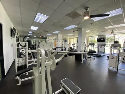 a gym with several treadmills and machines at Sunny Isles, beach life! Parking included in Miami Beach