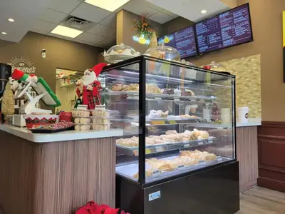 a bakery with a display case filled with pastries at Sunny Isles, beach life! Parking included in Miami Beach