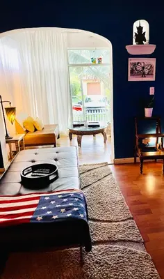 a living room with a couch and a table at Ne Miami Cottage in Miami