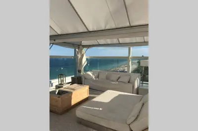 a living room with a couch and a table at Incredible Ocean Views! Terrace, 1800 sq.ft., Hotel in Miami Beach