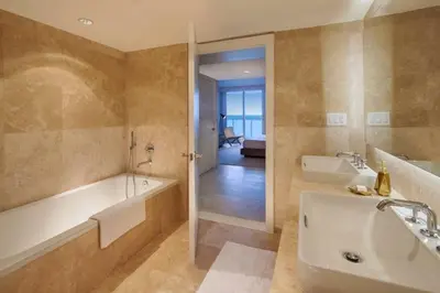 a large bathroom with a tub and a sink at Incredible Ocean Views! Terrace, 1800 sq.ft., Hotel in Miami Beach
