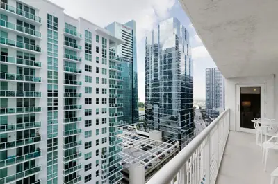 an apartment balcony with views of tall buildings at Miami Downtown Brickell spacious 4 Bedrooms 6 Beds in Miami