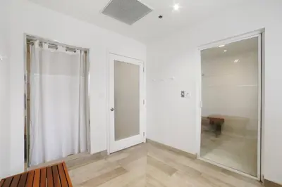 a white room with a mirror and a door at Miami Downtown Brickell spacious 4 Bedrooms 6 Beds in Miami