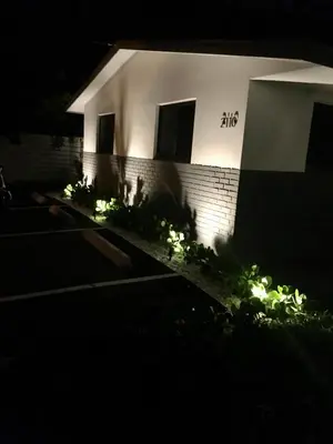 a building at night with lights in front of it at Harbourside Flats in Fort Lauderdale