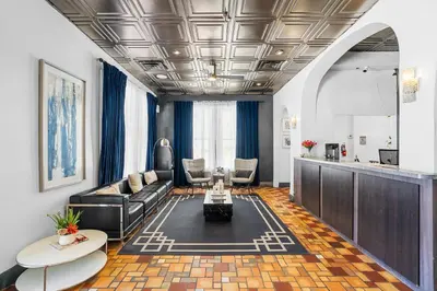 a living room with a couch and a table at Nine20 Collins Apartments by Lowkl in Miami Beach