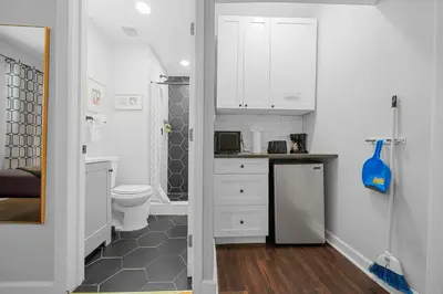 a small bathroom with a toilet and a sink at Nine20 Collins Apartments by Lowkl in Miami Beach