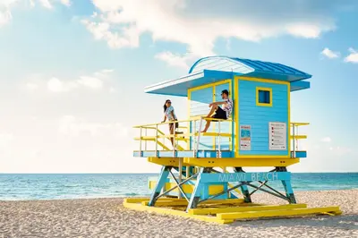 a life guard tower on the beach at Rock Apartments by Lowkl in Miami Beach