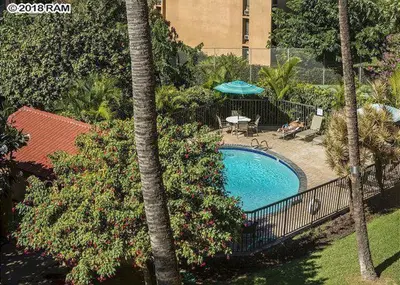 an overhead view of a swimming pool in a resort at South Maui Condos in Miami Beach