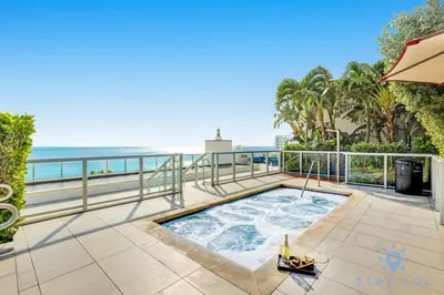 a hot tub on a balcony overlooking the ocean at Beachfront Resort - Hot Tub & Pool- Near Beach in Hollywood