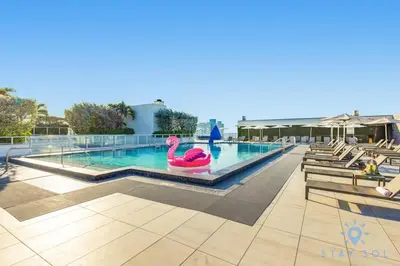 a swimming pool with a pink flamingo in the middle at Most Liked Home - Rooftop Pool - Hollywood Beach - Gym in Hollywood