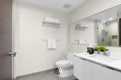 a white bathroom with a sink and a toilet at Modern Resort - Terrace - Up To 6 - Near Beach in Hollywood