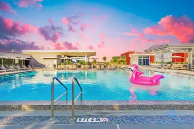 a pool with a pink rubber duck in the water at EXCLUSIVE APARTMENT - Rooftop POOL- Beachfront in Hollywood