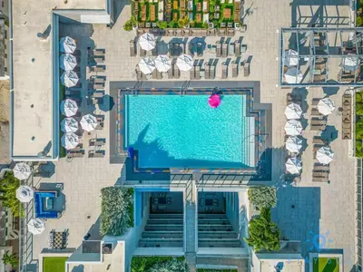 an overhead view of a swimming pool in a resort at EXCLUSIVE APARTMENT - Rooftop POOL- Beachfront in Hollywood