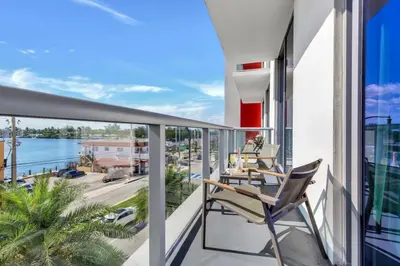 a balcony with chairs and a view of the water at Ocean View - Balcony - Hollywood Beach Broad-walk in Hollywood