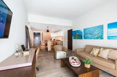 a living room with a couch and a table at NEW!Beachfront Condo Resort- Balcony in Hollywood