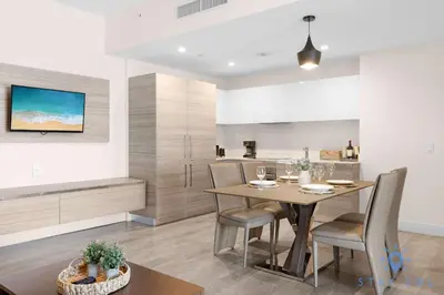 a dining room and kitchen with a table and chairs at Bay View - Rooftop Pool - Hollywood Beach Broad -walk in Hollywood