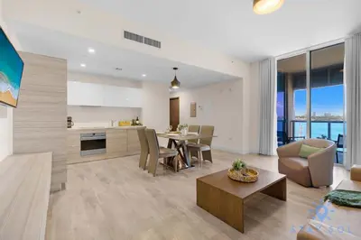 a living room and kitchen with a table and chairs at Bay View - Rooftop Pool - Hollywood Beach Broad -walk in Hollywood