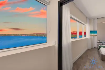 a room with a window with a view of the ocean at Bay View - Rooftop Pool - Hollywood Beach Broad -walk in Hollywood