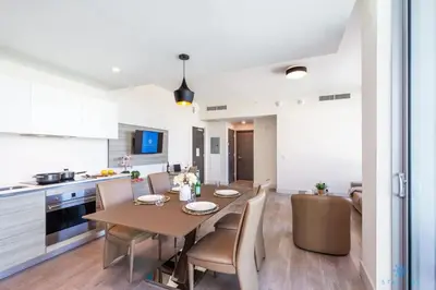 a kitchen and dining room with a table and chairs at Best Stay - Rooftop Pool - Hollywood Beach Board - walk in Hollywood