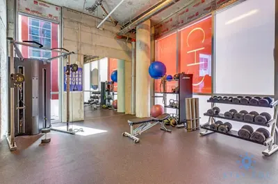 a gym with dumbbells and weights in a room at Best Stay - Rooftop Pool - Hollywood Beach Board - walk in Hollywood