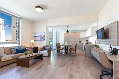 a living room with a couch and a table at Rooftop Pool- Gym - Hollywood Beach Broad - walk in Hollywood