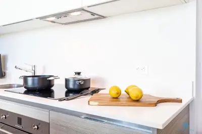 a kitchen counter with two lemons on a cutting board at Rooftop Pool- Gym - Hollywood Beach Broad - walk in Hollywood