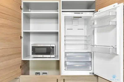 a kitchen with an open refrigerator with a microwave at Beachfront Condo-ROOFTO POOL- 2 BEDROOMS 2 BR ! in Hollywood
