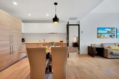 a kitchen and living room with a table and a couch at Best Stay - Rooftop Pool & Hot Tub - Hollywood Beach in Hollywood