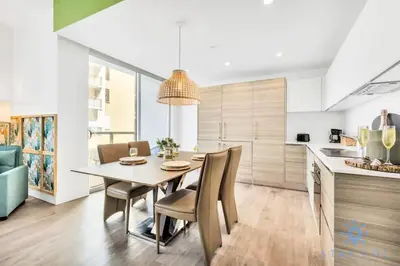 a kitchen and dining room with a table and chairs at Costa Hollywood - Worth Traveling - Rooftop Pool- Gym in Hollywood
