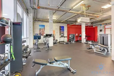 a gym with cardio equipment in a large room at Lx Oasis Beachfront-Rt infinity POOL in Hollywood
