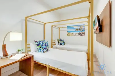 a bedroom with two canopy beds and a desk at Best Stay - Rooftop Pool - Broad - walk - Near Beach in Hollywood