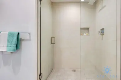 a bathroom with a shower with a glass door at Rooftop Pool & Hot Tub - Gym - Hollywood Beach in Hollywood