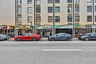 a group of cars parked in front of a building at Lovely apartment in the heart of South Beach in Miami Beach