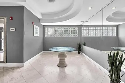 a room with a table in the middle of a room at Lovely apartment in the heart of South Beach in Miami Beach