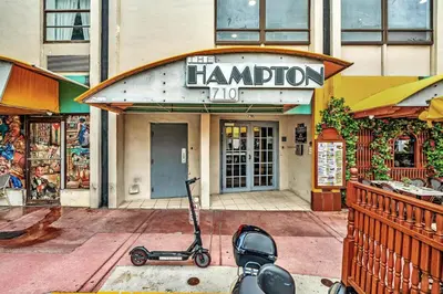 a scooter is parked in front of a store at Lovely apartment in the heart of South Beach in Miami Beach