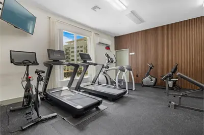 a gym with several exercise bikes in a room at Roami at Habitat Brickell in Miami