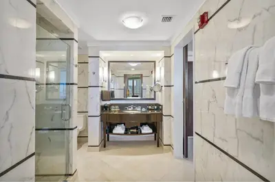 a bathroom with a sink and a mirror at Studio at Sorrento Residences- FontaineBleau Miami Beach home in Miami Beach