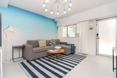 a living room with a couch and a table at Roami at 250 Collins in Miami Beach