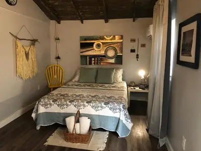 a small bedroom with a bed and a desk at Private and Secluded Studio in Little Havana - 6V in Miami
