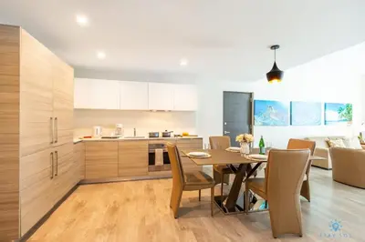 a kitchen and dining room with a table and chairs at Rooftop Pool - Hot Tub -Hollywood Beach Boardwalk in Hollywood