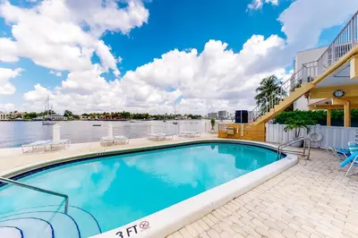 a swimming pool with a view of the water at Paradise Perch in Fort Lauderdale