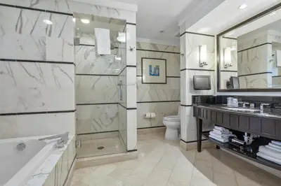 a bathroom with a tub and a toilet and a sink at Junior Suite at Sorrento Residences- FontaineBleau Miami Beach home in Miami Beach