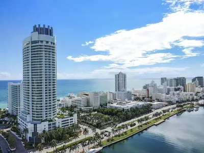 a city with a tall building next to the ocean at Junior Suite at Sorrento Residences- FontaineBleau Miami Beach home in Miami Beach