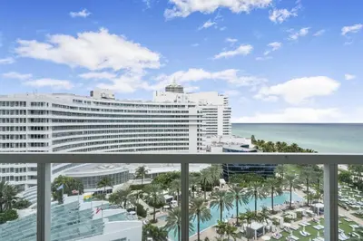 a view of the ocean from the balcony of a resort at Junior Suite at Sorrento Residences- FontaineBleau Miami Beach home in Miami Beach