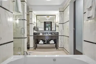 a bathroom with a tub and a large mirror at Junior Suite at Sorrento Residences- FontaineBleau Miami Beach home in Miami Beach