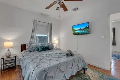 a bedroom with a bed and a ceiling fan at Casa Nikoleta Gated 3Bd 2Bth 10 Min to Beach in Miami