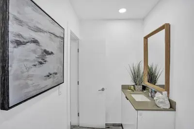 a bathroom with a sink and a mirror at Cozy studio wbeach boardwalk steps kitchen in Hollywood
