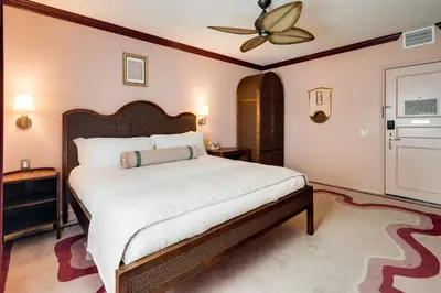 a bedroom with a large bed and a ceiling fan at Esme Miami Beach in Miami Beach