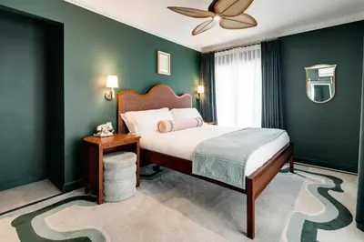 a bedroom with a bed and a ceiling fan at Esme Miami Beach in Miami Beach