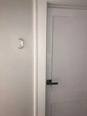a white door with a black handle and a door knob at Cozy Aqua Private Suite with Parking in Miami
